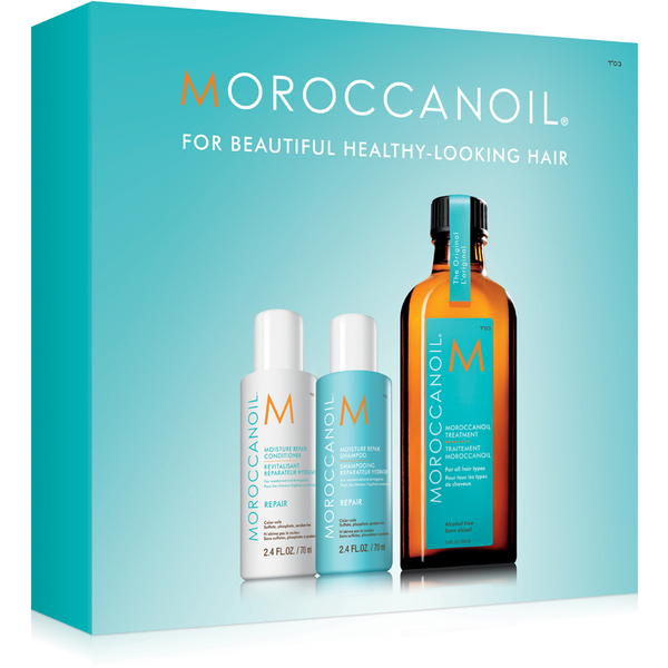 Set mini de produse Moroccanoil, incluzând șampon, balsam și tratament, ideal pentru îngrijirea părului.